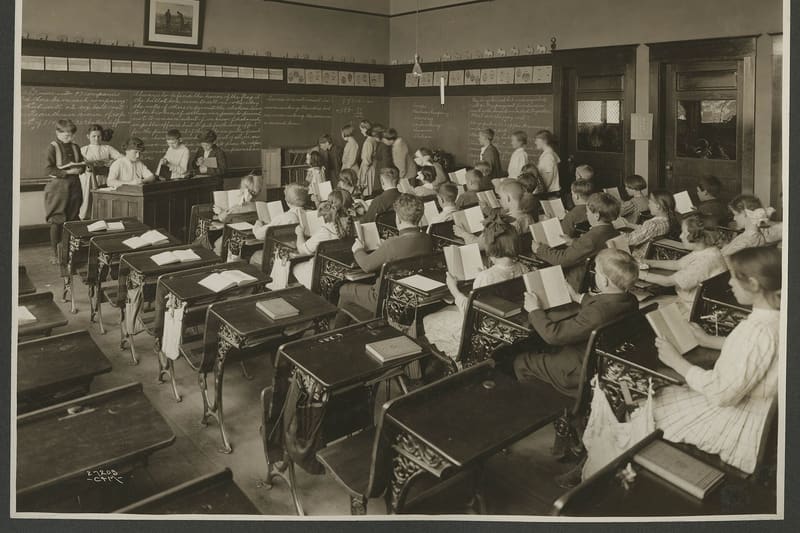 Children reading books classroom